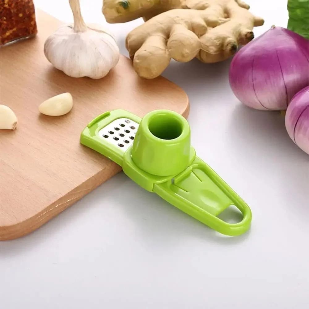 Rallador De Ajo Plastico Ojas De Acero Inox 14 Cm Grupo Dos — imagen 2 de 4