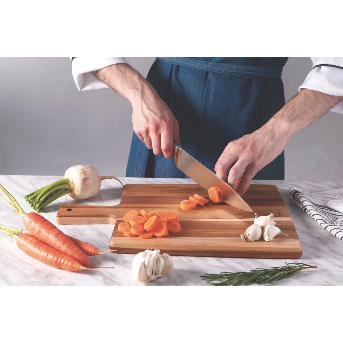Tabla De Madera Tramontina Cocina Picar Teca Mango 34 Cm — imagen 3 de 4